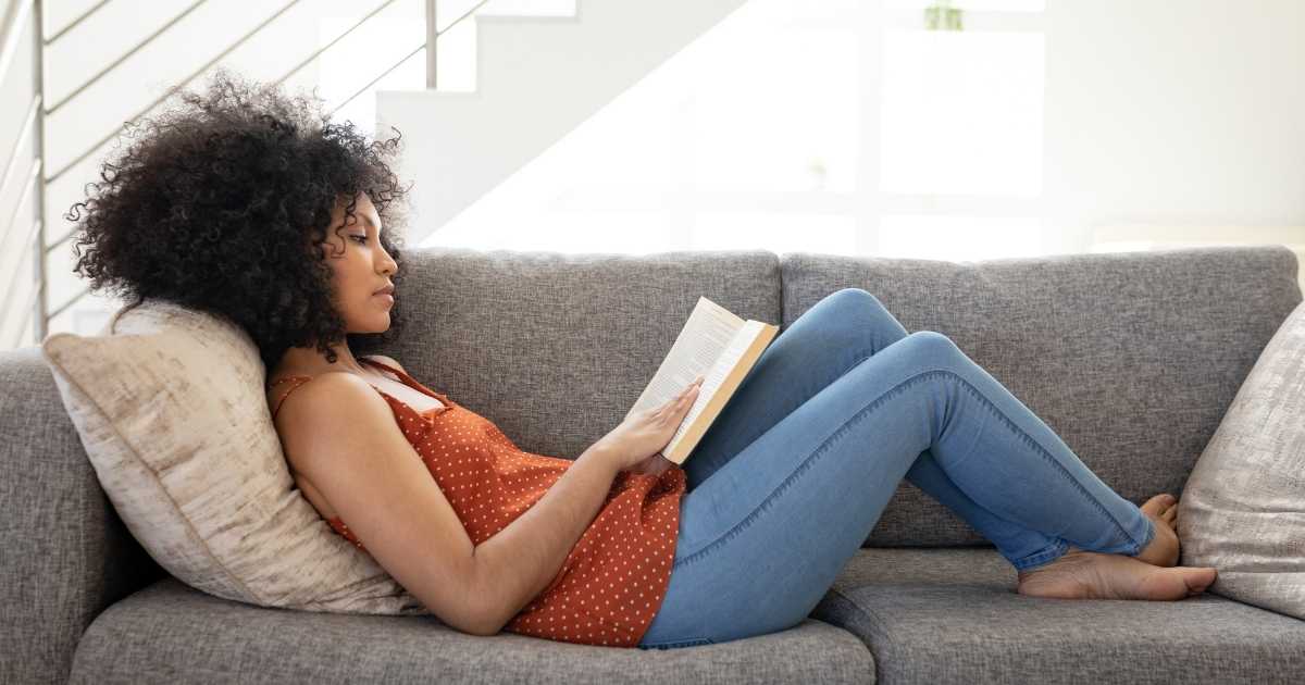 reading book in couch